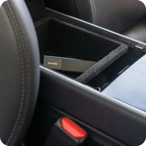 A Classic GPS Tracker hidden in the central console of a car