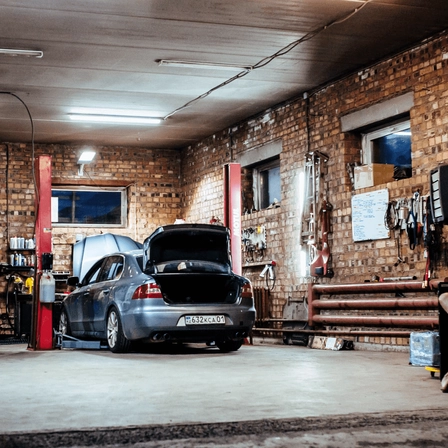 A car being repaired in a garage