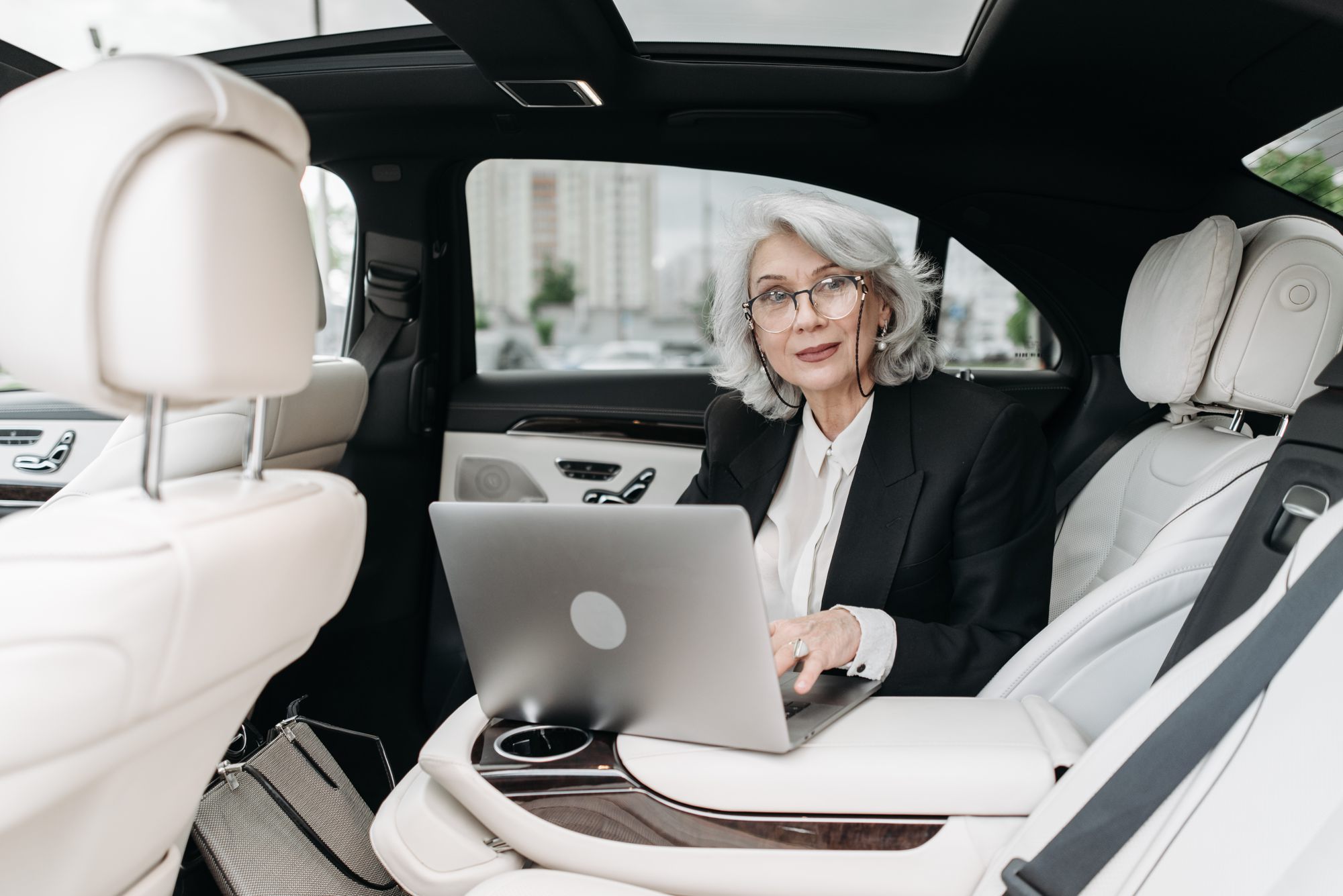 Image 4: car interior with a person