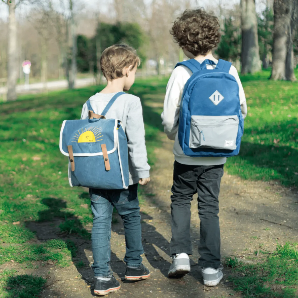 Child with a discreet GPS tracker in a backpack